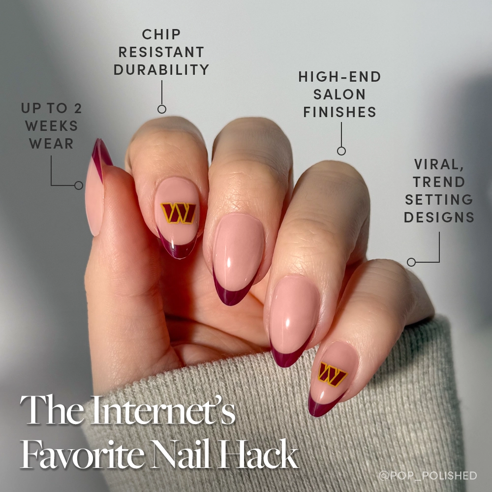 The glamnetic Washington Commanders Press-On Nail Set features long almond nails with a glossy nude base, deep burgundy tips, and gold geometric fan-inspired accents. Enjoy salon-quality durability, long-lasting wear, and on-trend designs. - Product image
