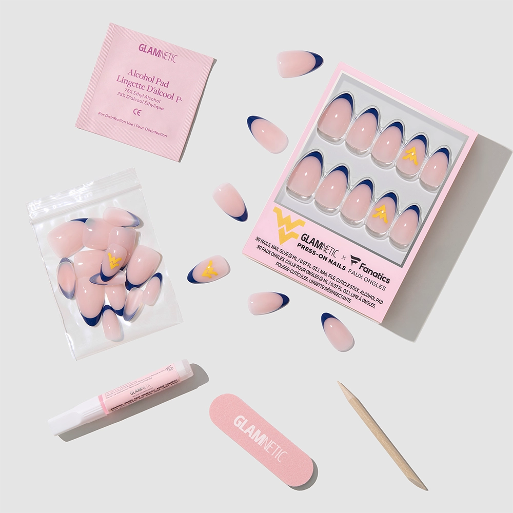 The glamnetic West Virginia Mountaineers Press-On Nail Set includes pink and blue nails with a yellow W logo, pink nail glue, cuticle stick, nail file, alcohol pad, and extra nails—all arranged on a light gray background. - Product image