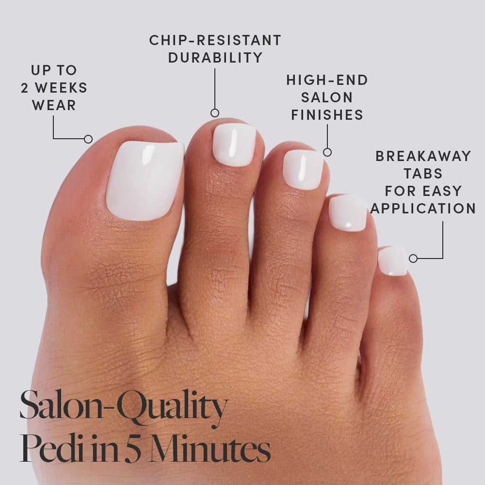 A close-up of toes with glamnetic White Swan Toenail, showcasing glossy white nails. Enjoy up to 2 weeks' chip-resistant wear, salon-quality finish, and breakaway tabs for easy press-on use. Caption: "Salon-Quality Pedi in 5 Minutes. - Product image