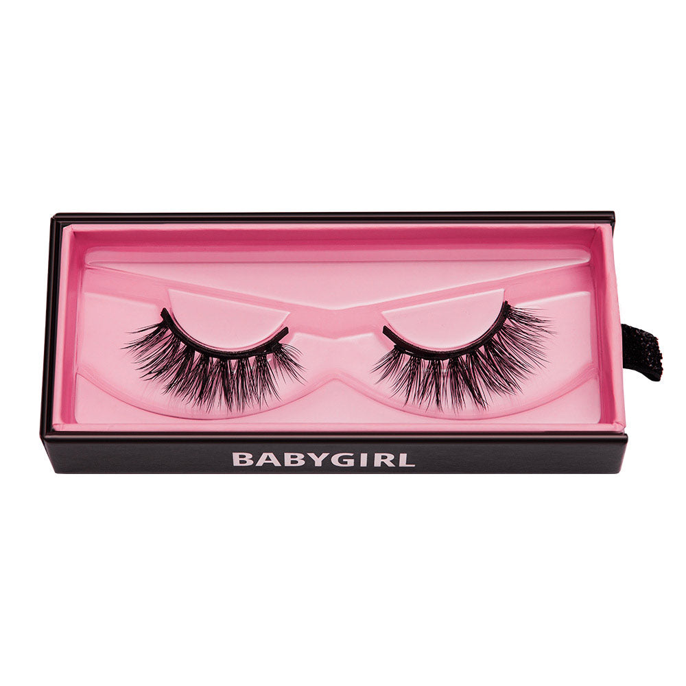 A pair of dramatic Babygirl vegan reusable lashes by glamnetic, packaged in a pink-lined rectangular box with BABYGIRL in white letters—perfect for adding bold glamour to any look. - Product image