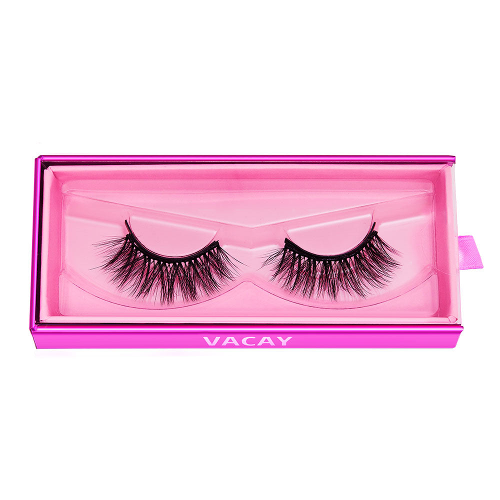 Glamnetics Vacay features dramatic, vegan-friendly black lashes made from synthetic fibers. The thick, wispy pair comes displayed side by side in a pink rectangular box with a clear lid. - Product image