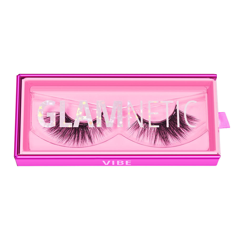 A pair of vegan-friendly false eyelashes from glamnetic, named Vibe, housed in a pink rectangular box with glamnetic on the clear lid and Vibe on the front bottom edge. - Product image
