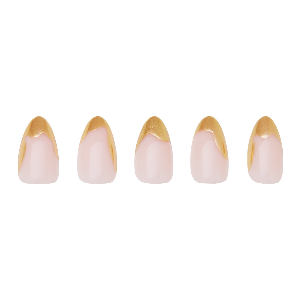 Golden Touch by glamnetic features five short almond-shaped artificial nails with a pale pink base and abstract gold foil French tips, arranged in a row on a white background. - Product image
