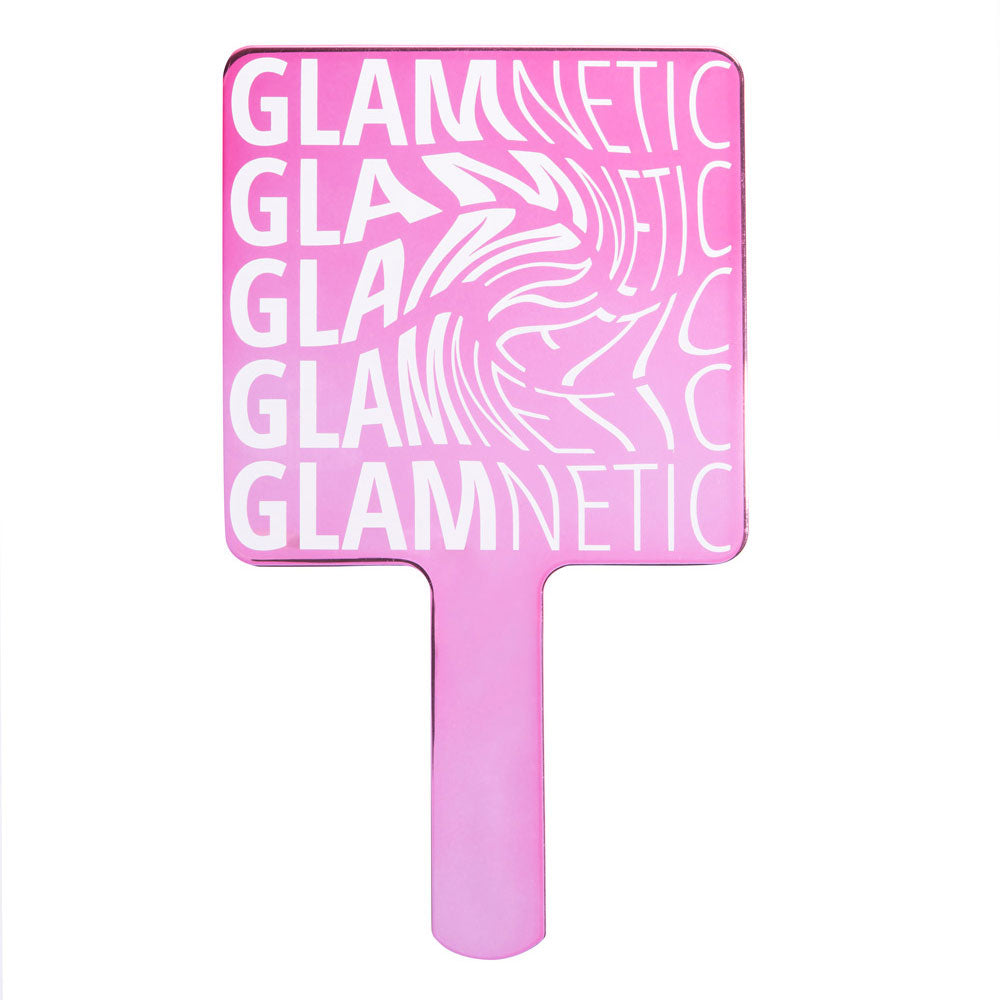 The glamnetic Handheld Mirror is a pink compact mirror ideal for lash application, with glamnetic printed repeatedly in white in a wavy pattern on the back. - Product image