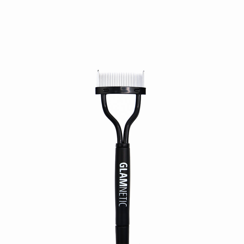 The glamnetic Foldable Lash Comb features thin metal bristles and a handle with GLAMNETIC printed vertically—ideal for precise lash separation, shown against a plain white background.